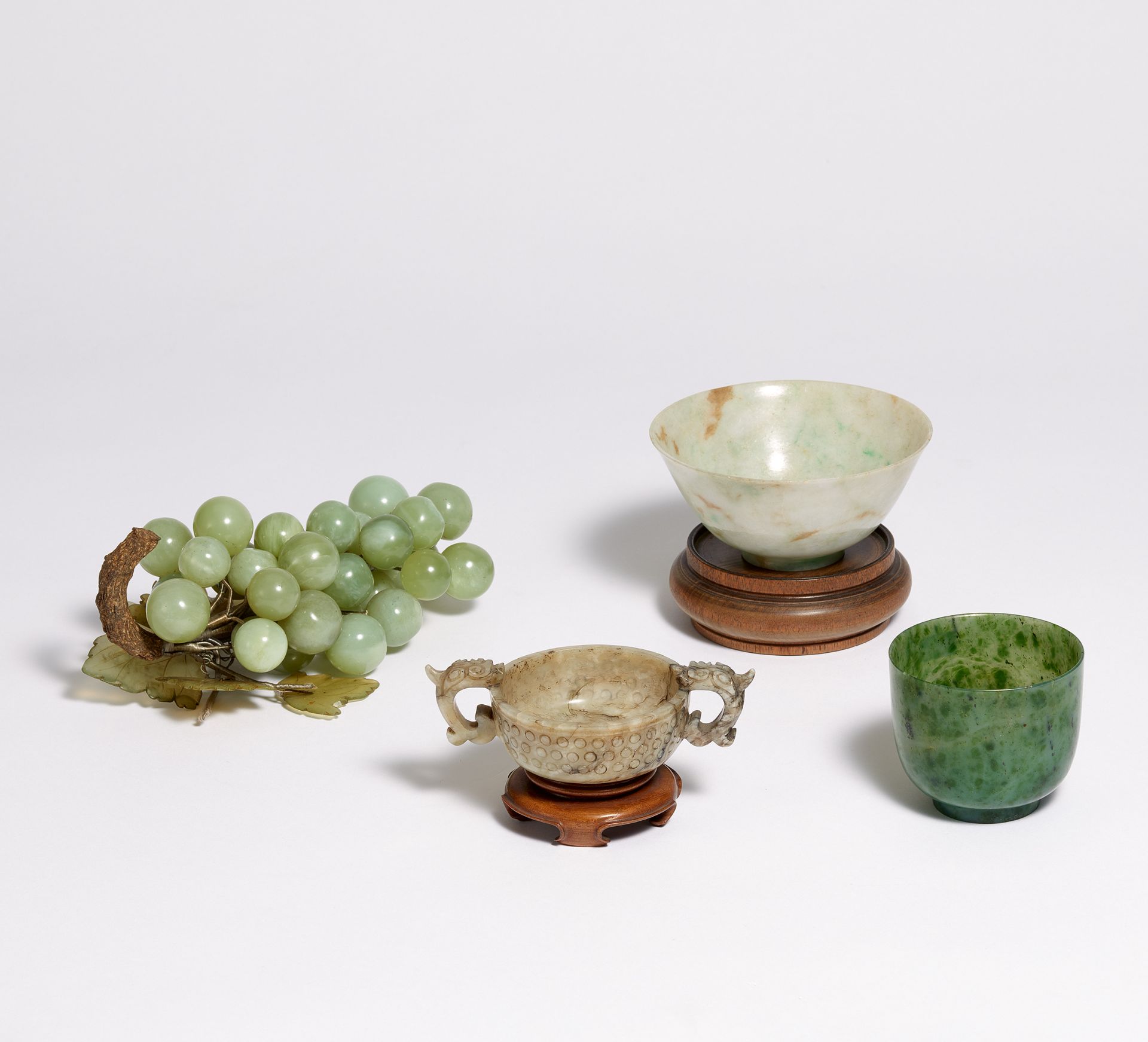 WEDDING BOWL WITH DRAGON HANDLES AND TWO DRINKING BOWLS. 19th-20th c. Jade, grey with dark veins,