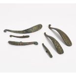 SIX ELEGANT BELT HOOKS. China. In the style of the Waring States resp. Han-Dynasty, but prob. later.