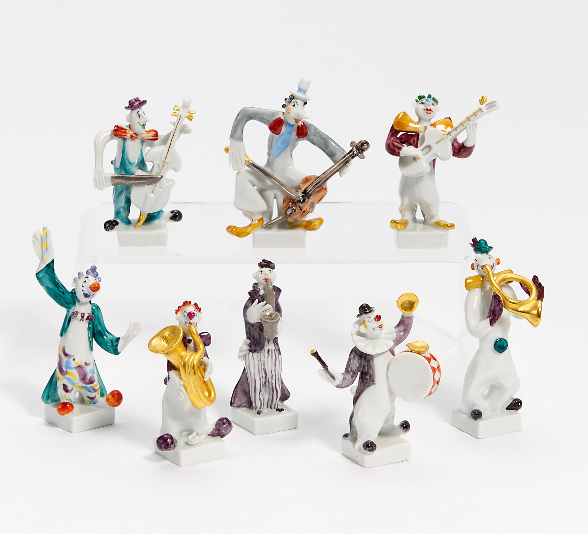 KLEINE CLOWN-KAPELLE. Meissen. Modell Peter Strang. Porzellan, farbig, gold & platin staffiert.