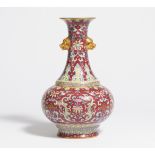 VASE WITH CHI DRAGONS AND LION HEAD HANDLES. China. Porcelain painted in famille rose and gold on