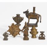 SEVEN SMALL FIGURES. India. 18th-19th c. Bronze with dark patina. a) Nandi bull. H.11cm. b)