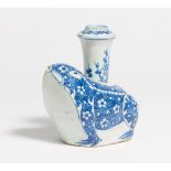 KENDI IN THE SHAPE OF A FROM WITH FLOWERING PLUM. China. Porcelain, painted underglaze blue.