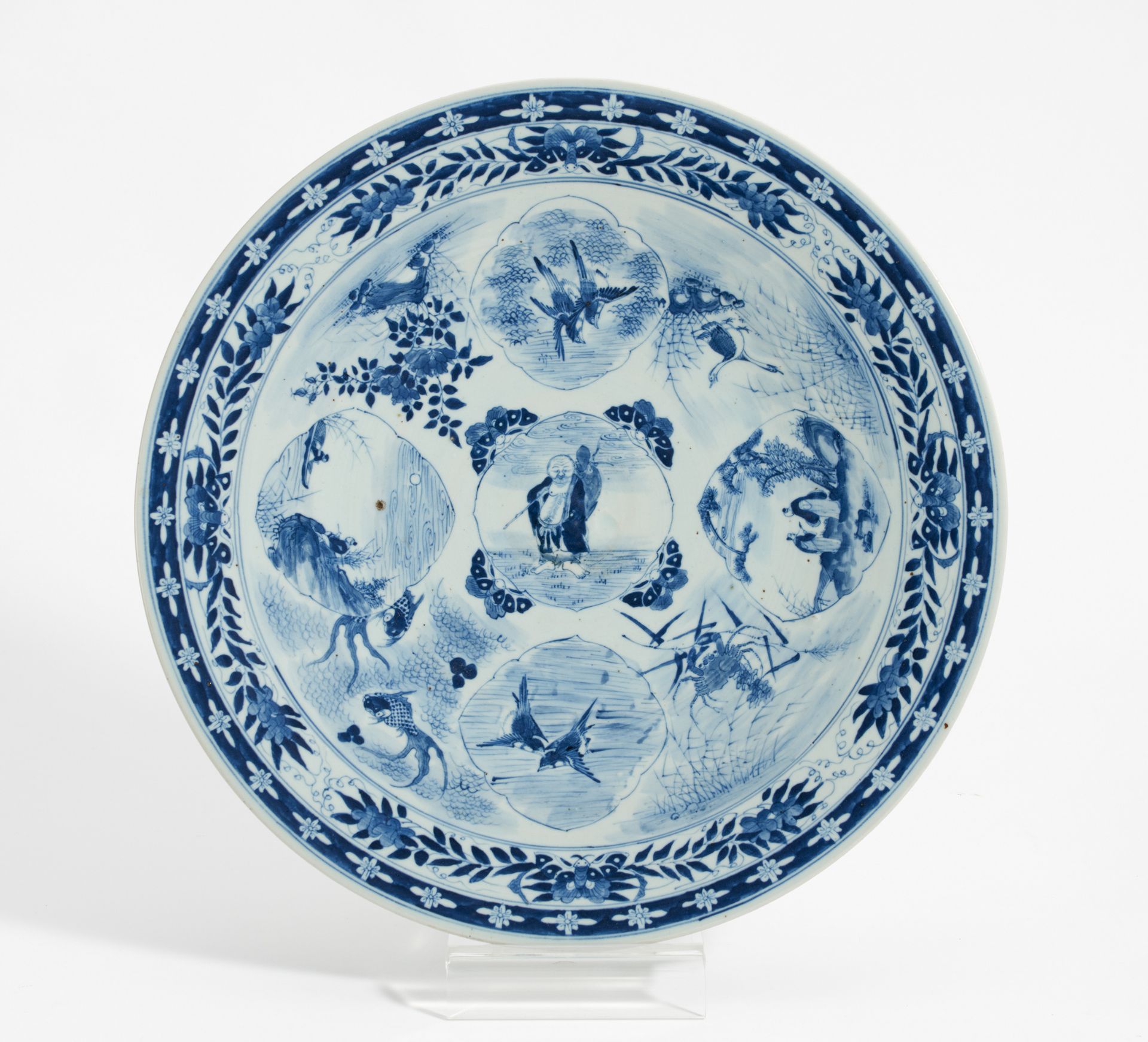LARGE DISH WITH HOTEI, LANDSCAPE MEDALLIONS, BIRDS AND WATER ANIMALS. Japan. 19th c. Porcelain