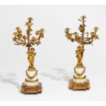 PAIR OF CANDELABRA STYLE LOUIS XV WITH CUPIDS MADE OF MARBLE AND BRONZE. Paris. End of the 19th