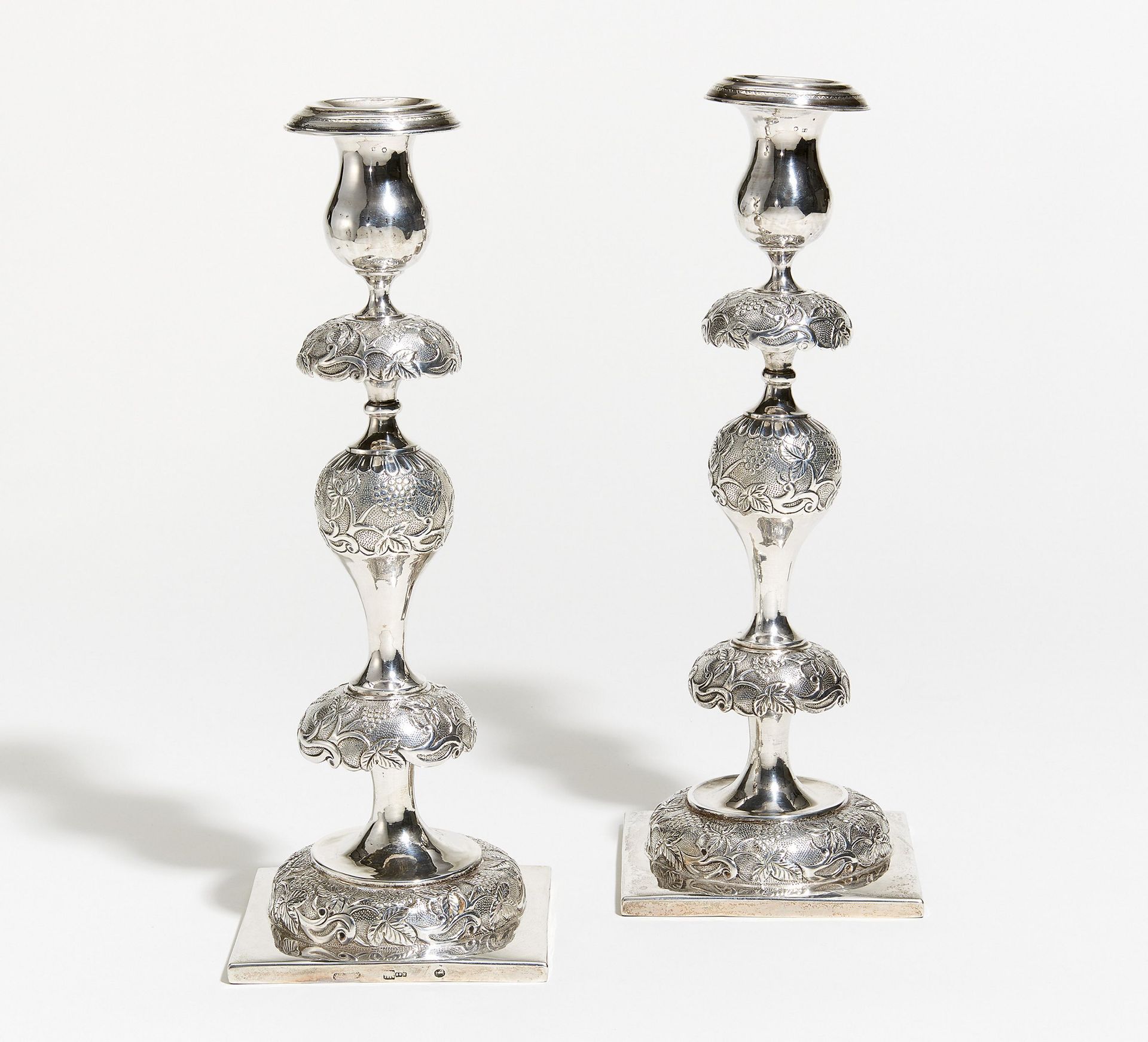 PAIR OF SILVER CANDELABRA WITH VINE DECOR. Presumably Russia. 19th century. Silver. Ca. 940g. Height