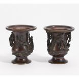 TWO SIMILAR SMALL DRAGON VASES. Japan. Meiji period. Ca. 1900. Bronze with shiny dark brown