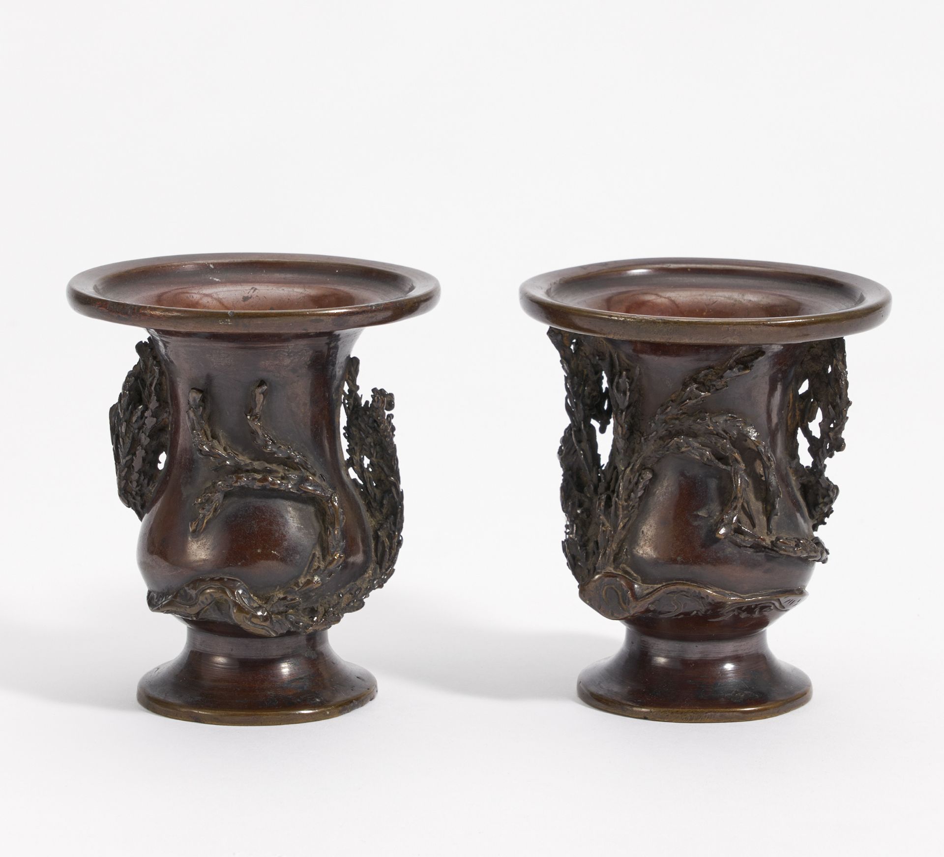 TWO SIMILAR SMALL DRAGON VASES. Japan. Meiji period. Ca. 1900. Bronze with shiny dark brown