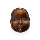 NETSUKE: MASKE OF OKAME. Japan. Edo period. 19th c. Boxwood with shiny patina. Laughing and chubby