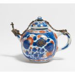 SMALL TEA POT. China. 18th c. Export porcelain painted in underglaze blue with iron red and gold