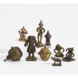 NINE SMALL FIGURES, MASK AND BOX. India. 18th-20th c. Bronze, partly with dark patina and residue of