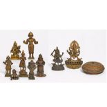 NINE DEITY FIGURES, ONE SACIFICIAL BOX AND A THANGKA OF RAHULA. India/Nepal. 17th-20th c. Bronze/