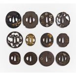 TWELVE TSUBA. Japan. 18th-19th c. and earlier. Two in bronze, ten from iron. Partly with inlay and