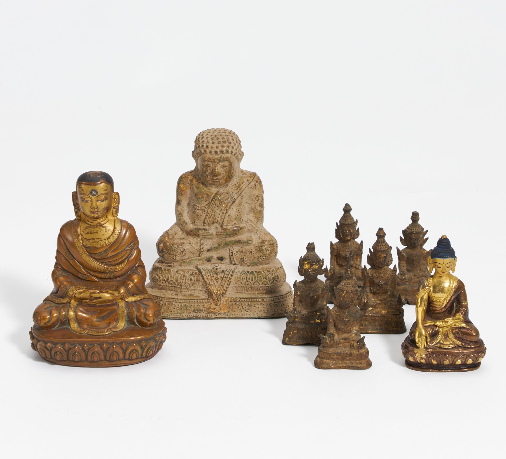 EIGHT SMALL BUDDHIST FIGURES. Nepal, Burma, Thailand. 19th-20th c. Bronze, Partly with gilding. H.