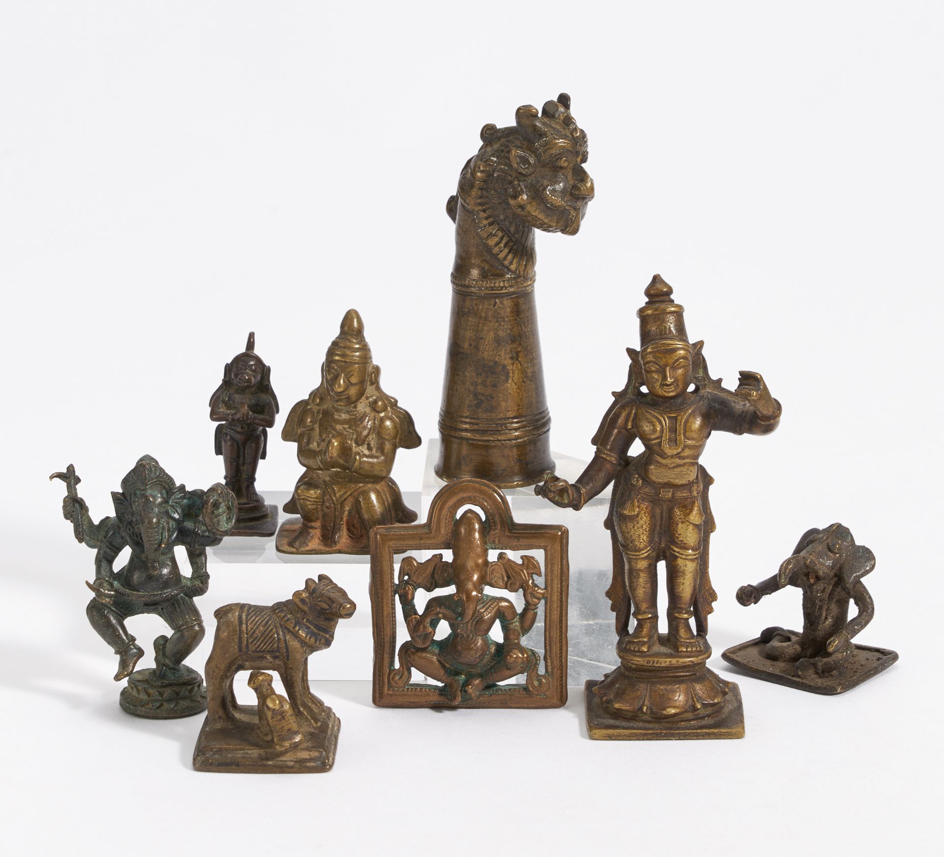 EIGHT SMALL FIGURES. India. 18th-20th c. Bronze with dark patina. a) Standing goddess. H.10.2cm.