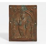 KISSING PLATE WITH FOUR ARMED SHIVA VIRABHADRA. India. 18th-19th c. Copper, repoussé in high relief.