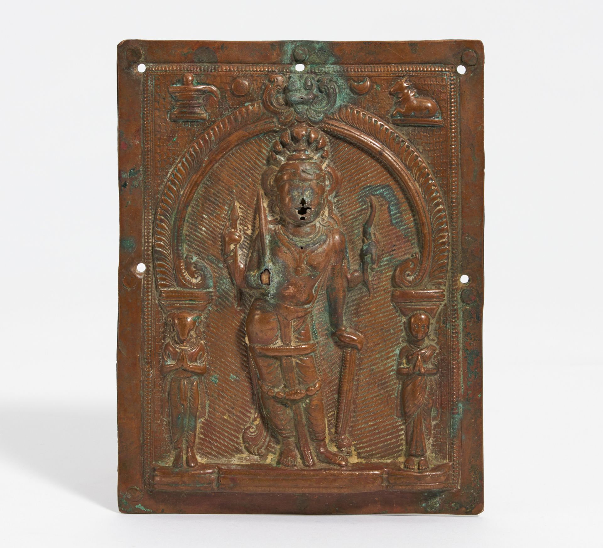 KISSING PLATE WITH FOUR ARMED SHIVA VIRABHADRA. India. 18th-19th c. Copper, repoussé in high relief.