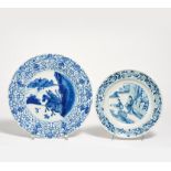 TWO UNDERGLAZE BLUE DISHES WITH LOTOS RIM. China. Porcelain painted underglaze blue. a) Two