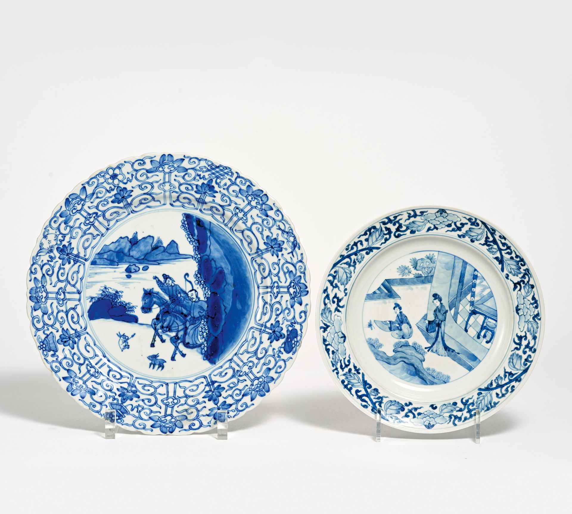 TWO UNDERGLAZE BLUE DISHES WITH LOTOS RIM. China. Porcelain painted underglaze blue. a) Two
