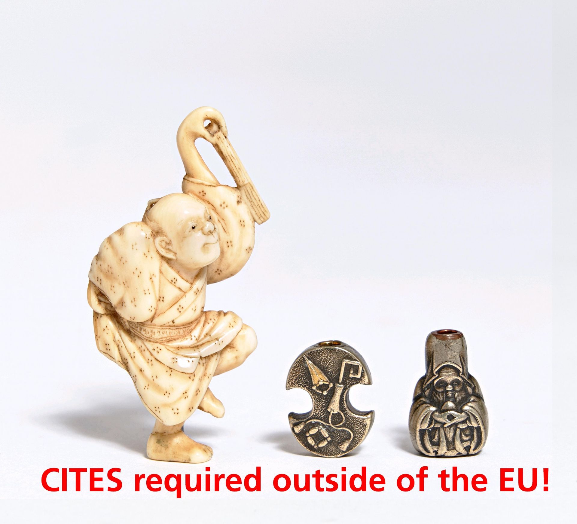 NETSUKE AND TWO OJIME. Japan. 19th c. a) Dancing man. Ivory. Flat form carving. H.5cm. Bez.: