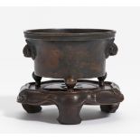 CENSER WITH LION HEADS. China. Ming dynasty or later. Bronze with dark patina. H.6cm, Ø 9.8cm.