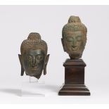 TWO SMALL BUDDHA HEADS. Thailand. Ayutthaya period (1350-1767). Bronze with dark patina, one with