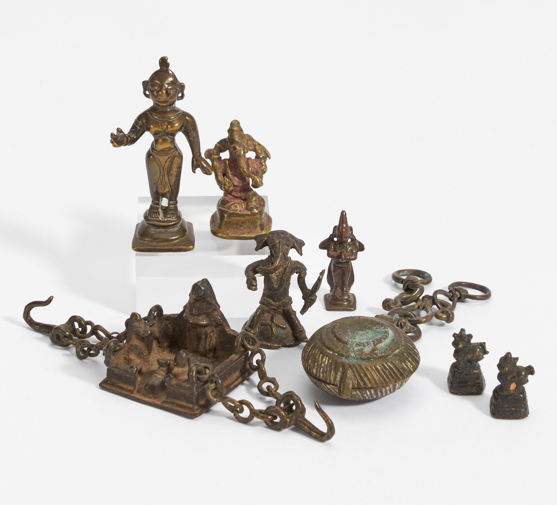 EIGHT FIGURES OF GODS AND OTHERS. India. 18th-20th c. Bronze with dark patina and residue of