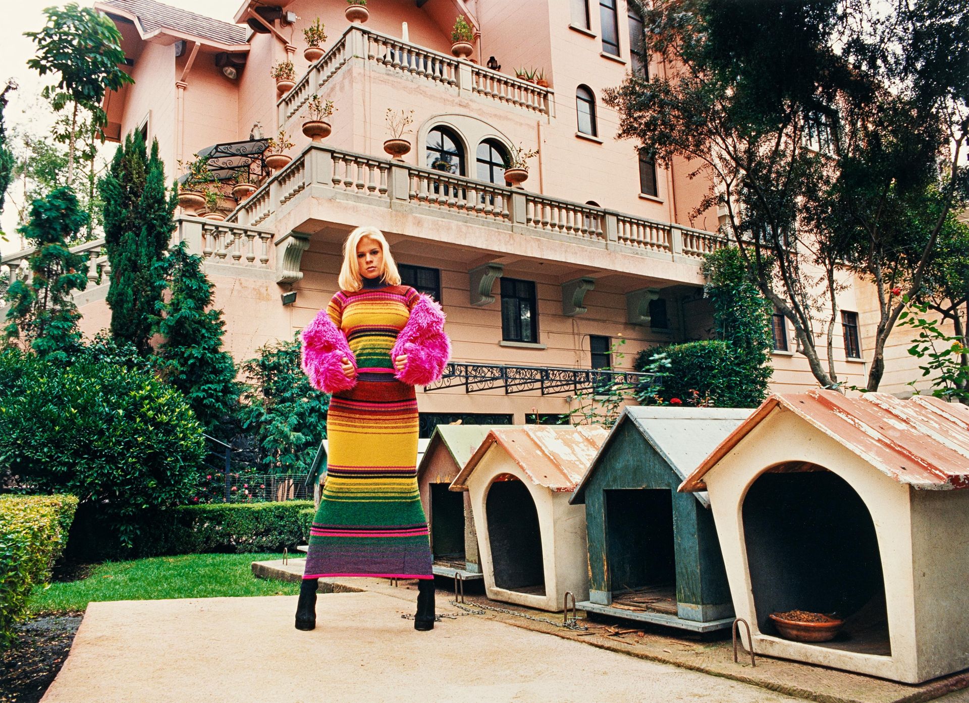 Daniela Rossell: Untitled (Inge with Dog Houses)