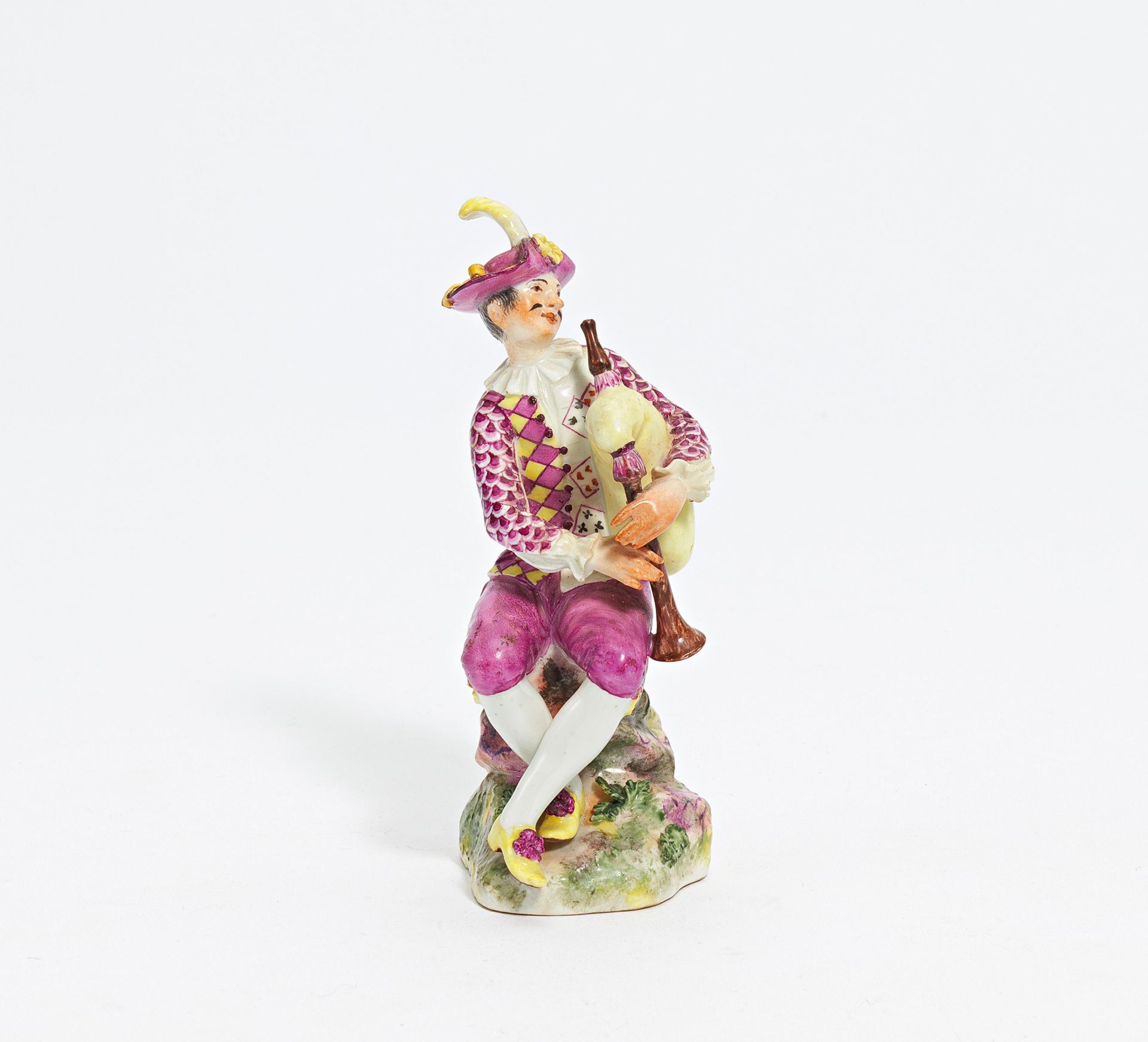 Porcelain figurine of a packpipe player