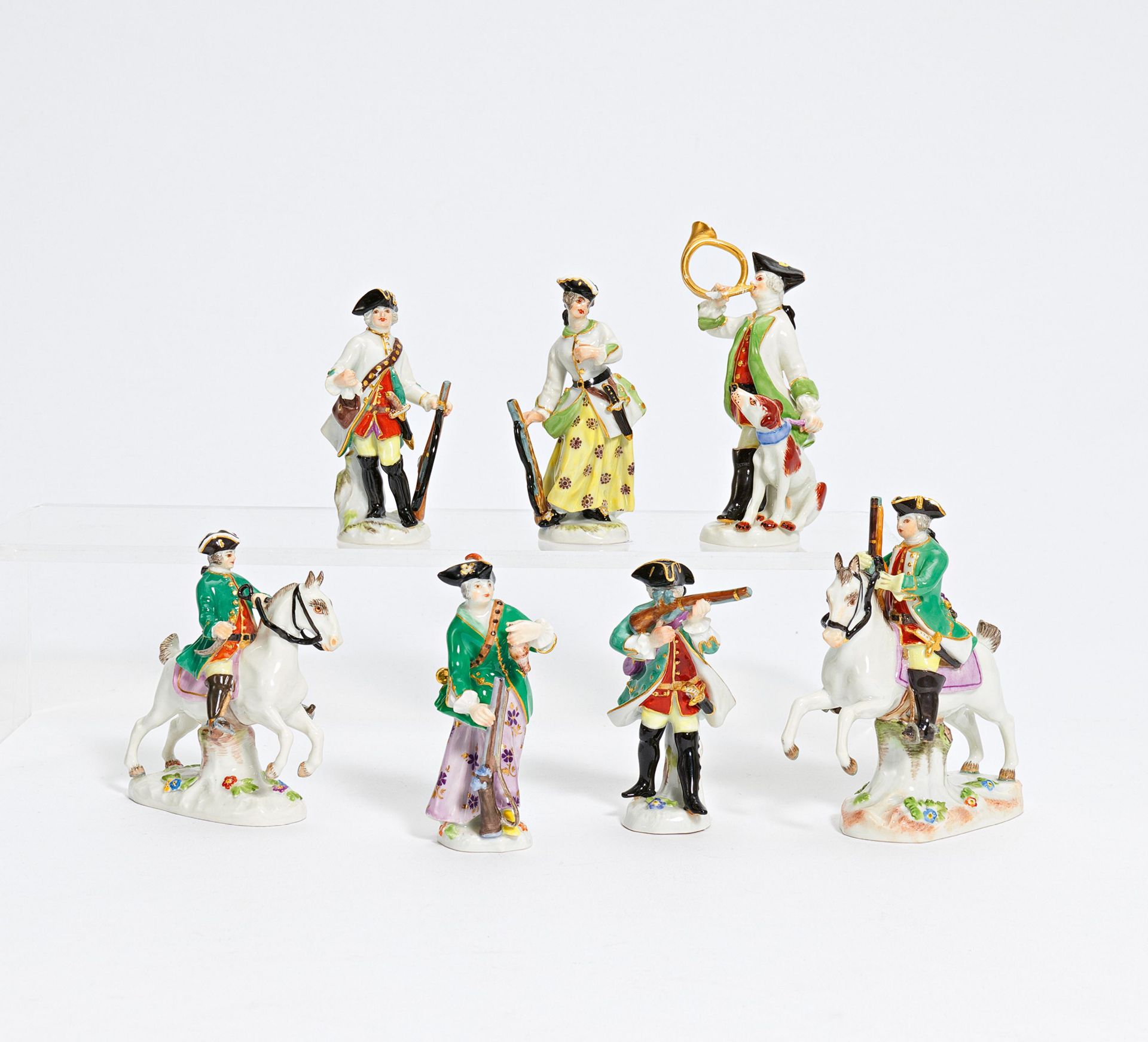 7 miniature porcelain figurines of hunters and huntresses