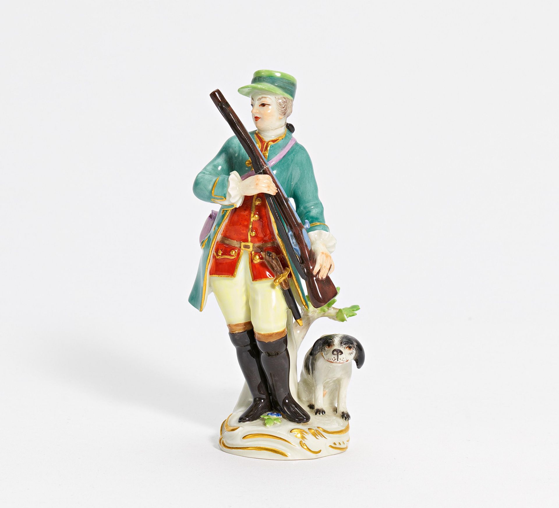 Porcelain figurine of hunter with musket and dog