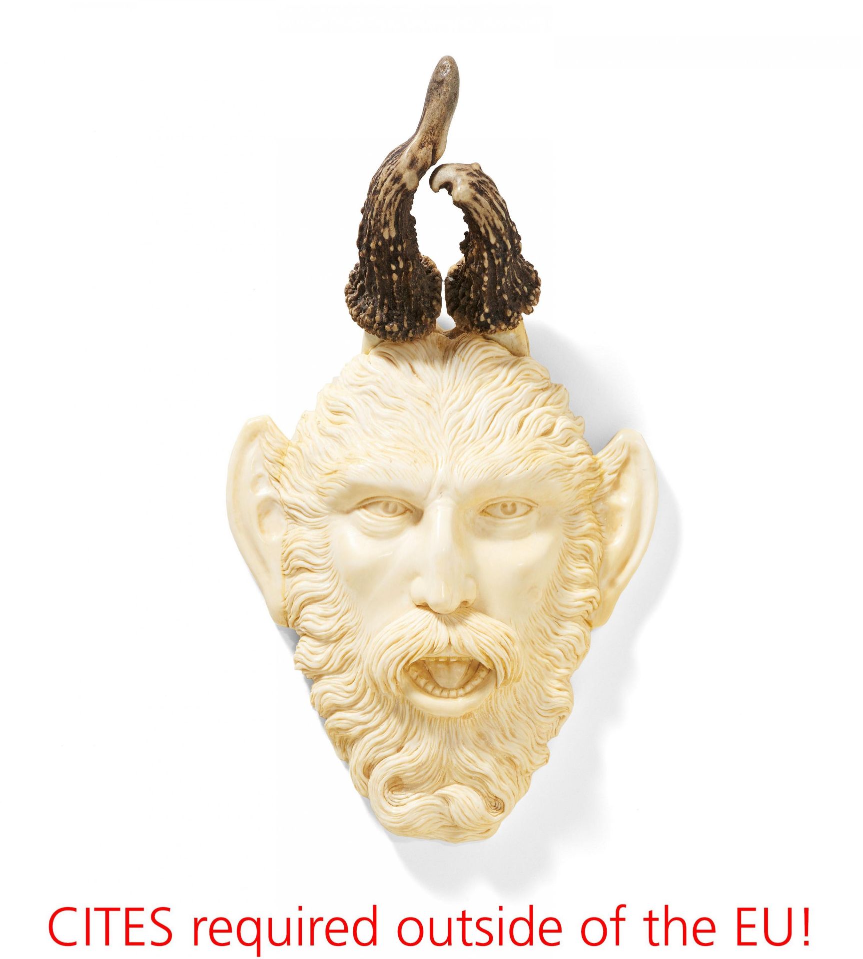 Ivory head of a satyr with roebuck antlers