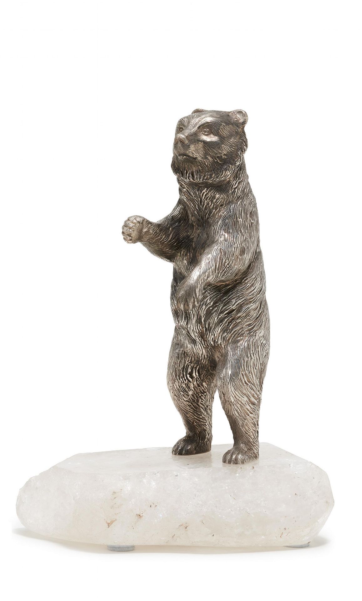 Silver figurine of a standing bear mounted on mountain crystal