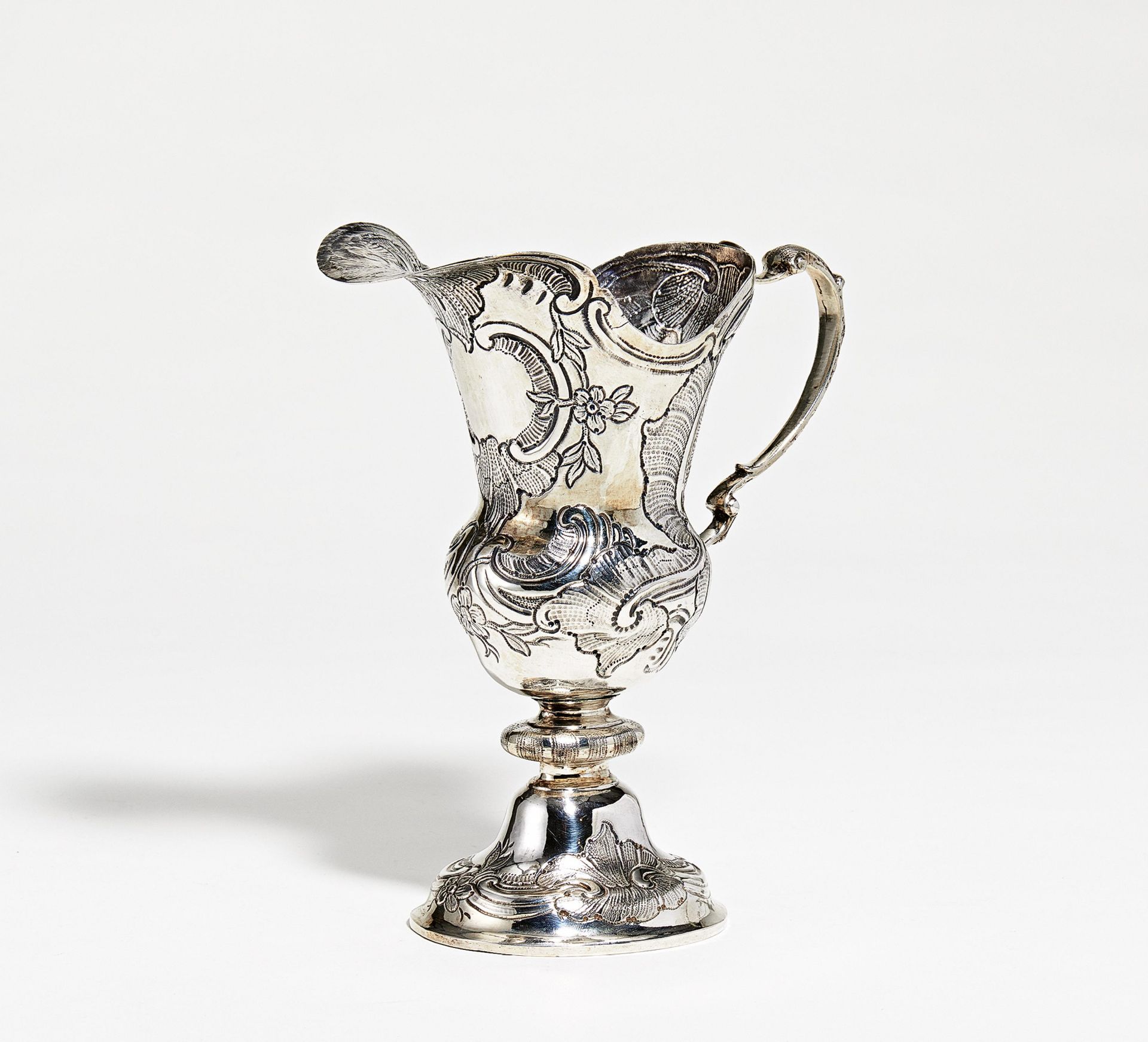 Silver helmet shaped jug with rocaille décor