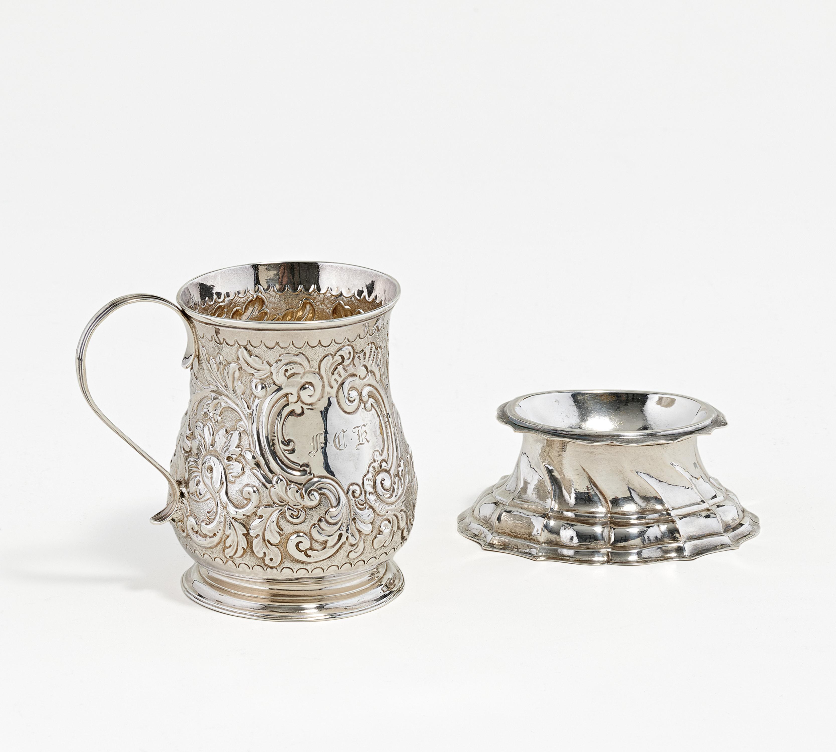 Silver salt dish and small George II mug with relief décor