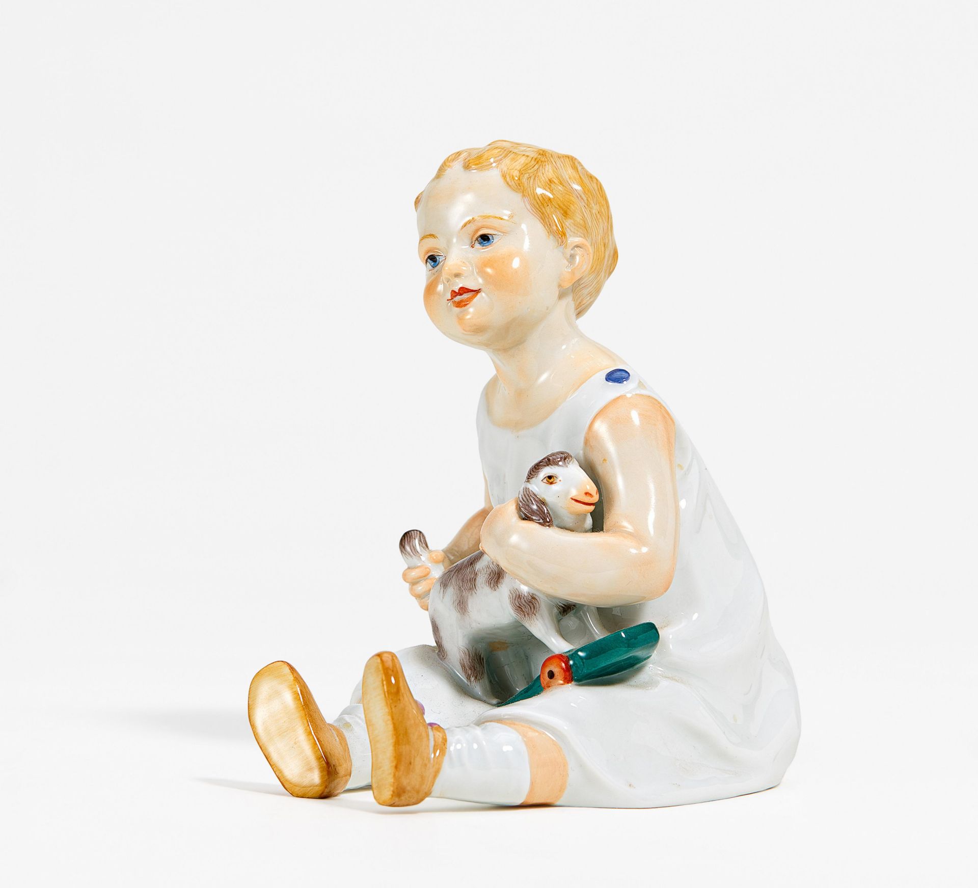 Porcelain figurine of sitting girl with sheep