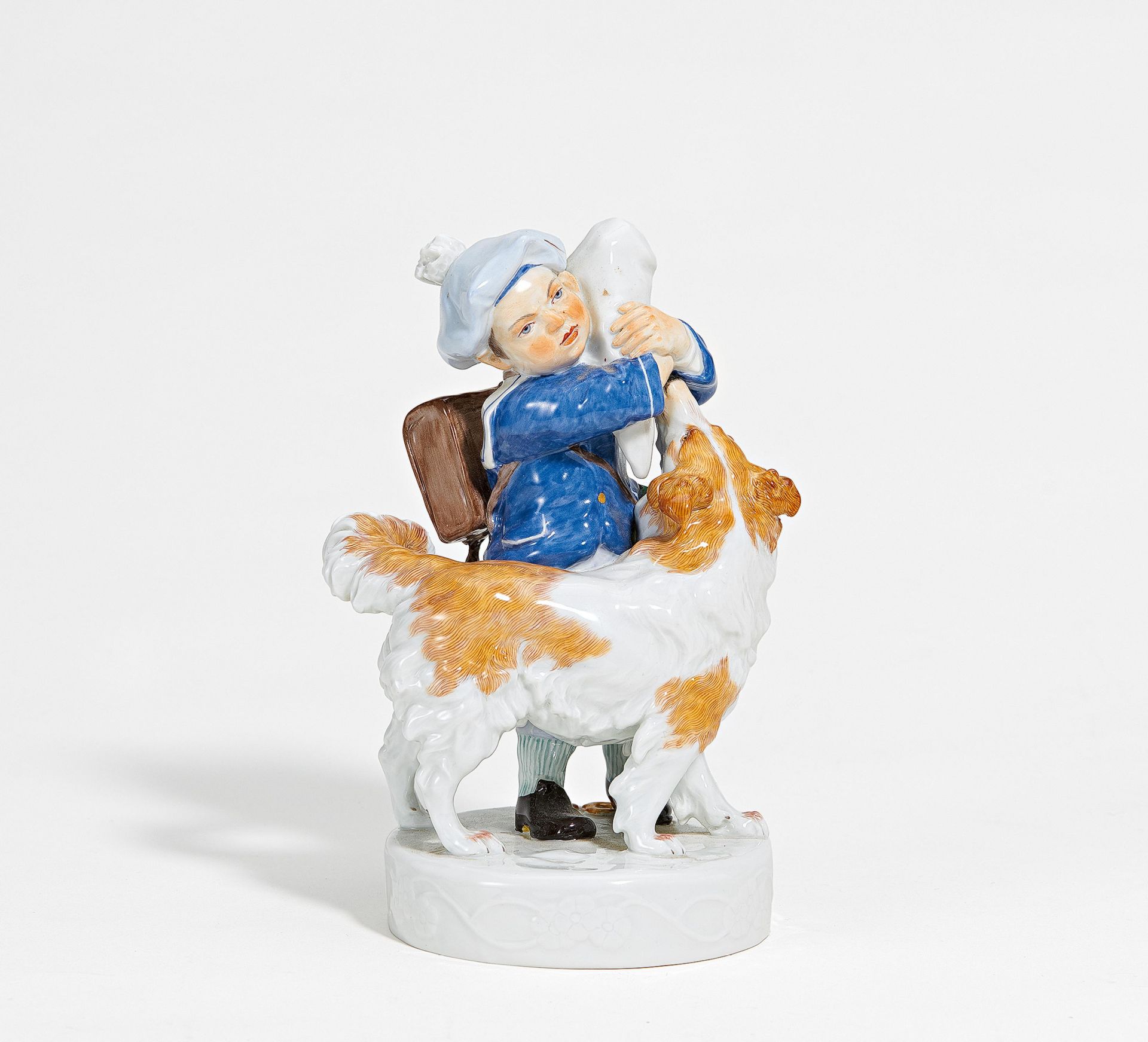 Porcelain figurine of school boy with dog