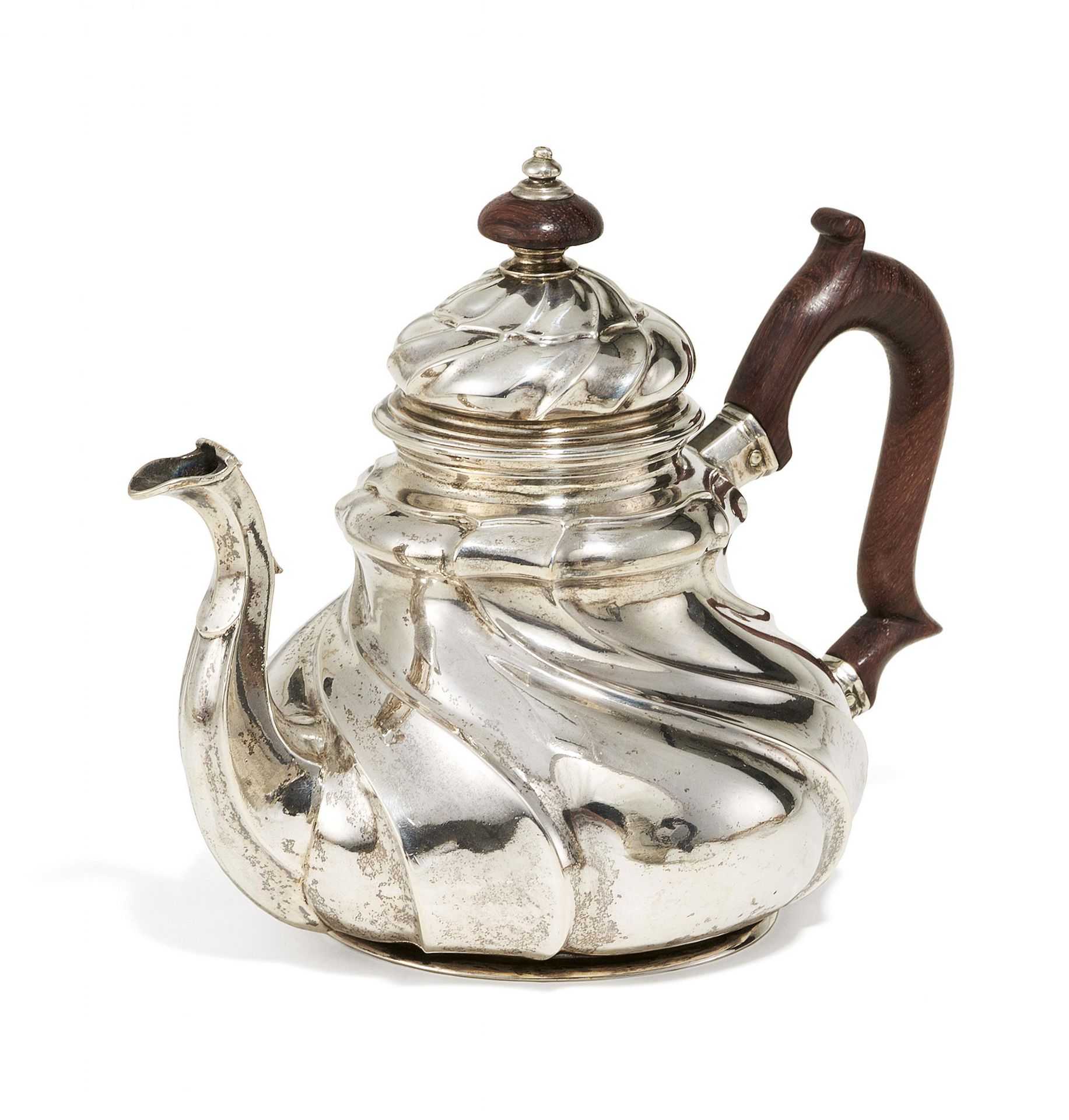 SILVER TEAPOT WITH TWIST-FLUTED FEATURES.