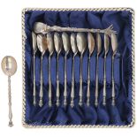 (13) Piece set of teaspoons and lump tongs silver.