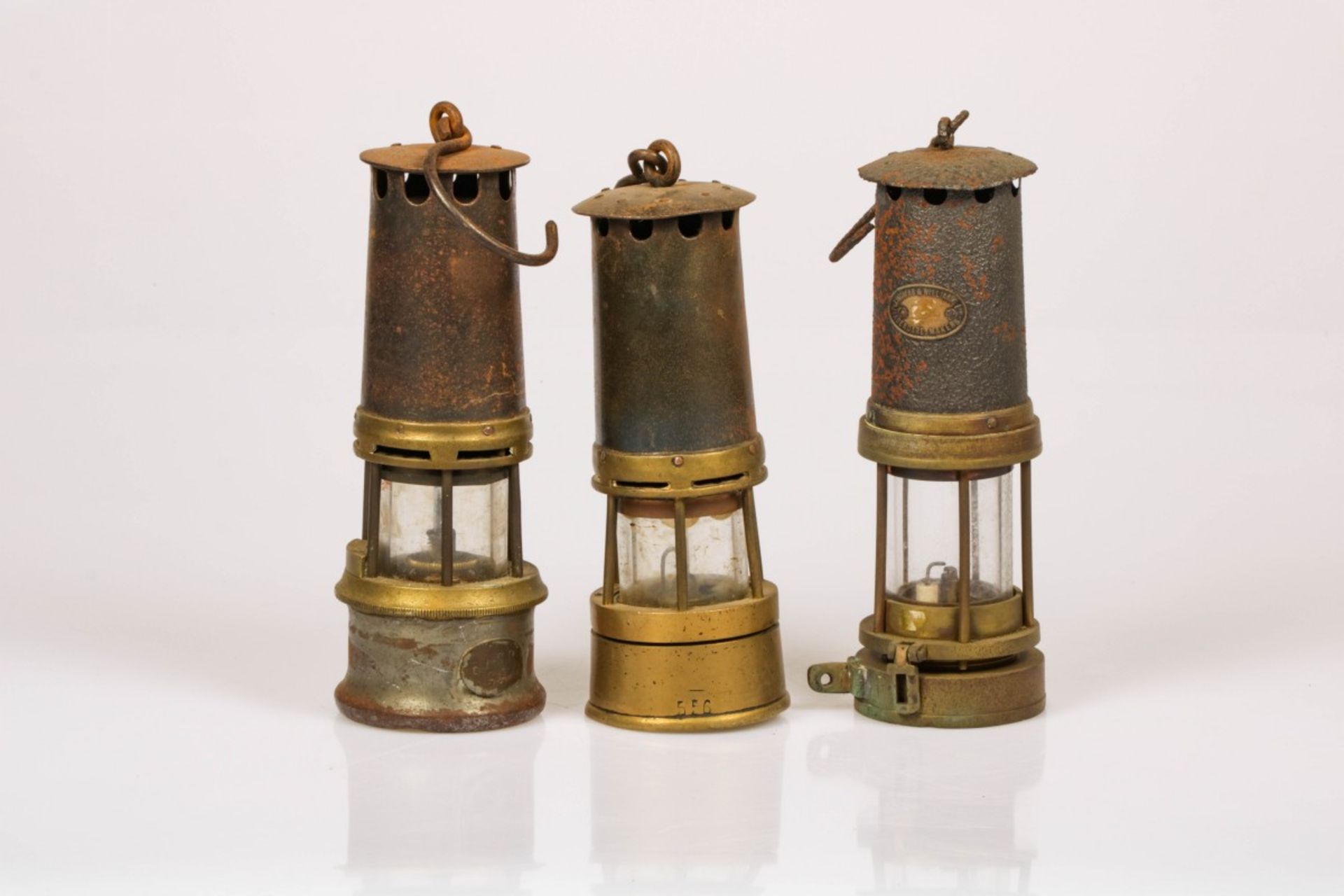 A convolute of (3) miners' lamps, 20th century.