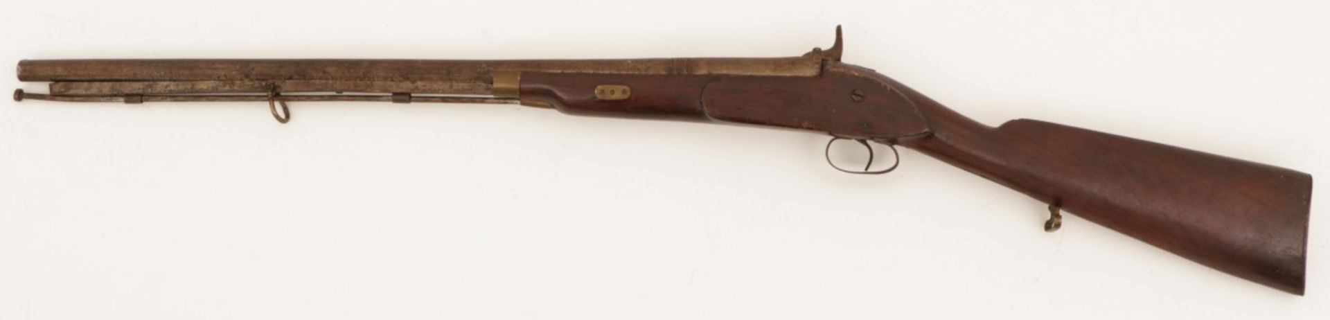 A flintlock percussion rifle, England, late 19th century.