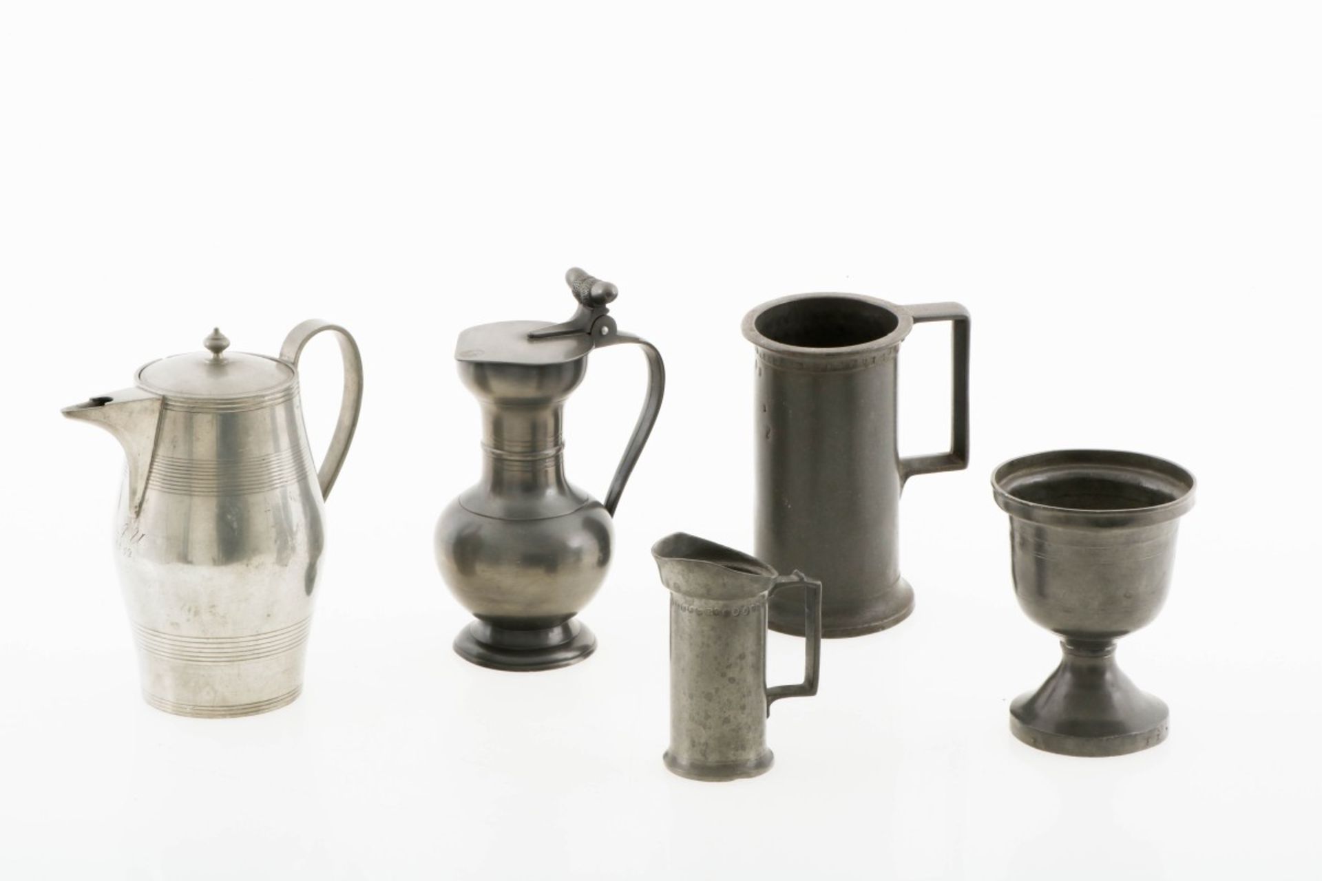 A lot of various pewterware including an acorn finial pitcher, 20th century.