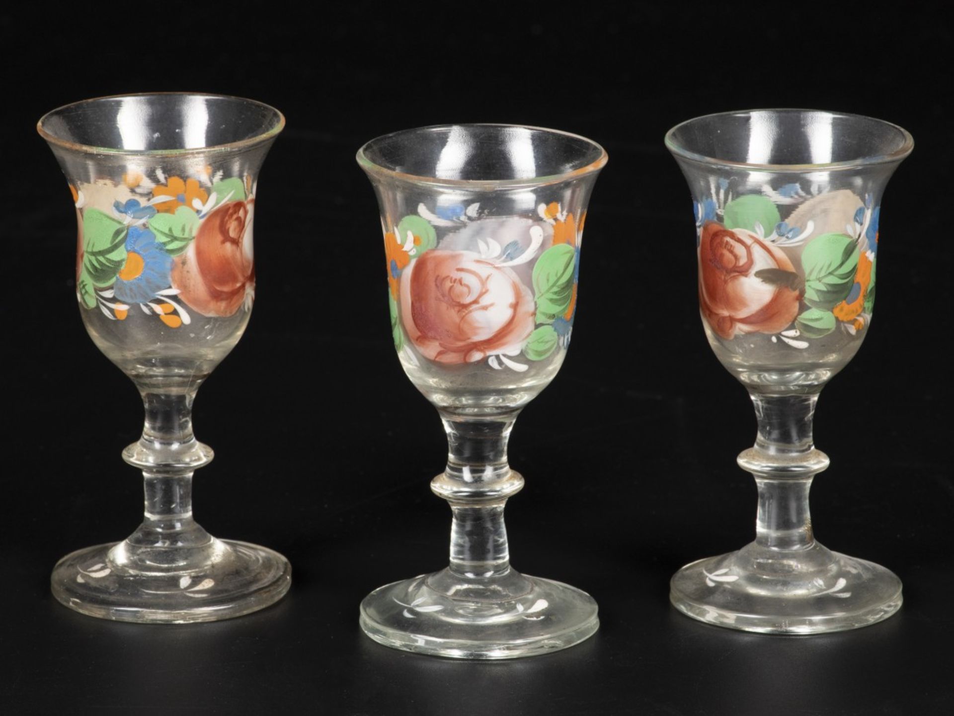 A set of (3) cold-painted liquor glasses, 19th century.