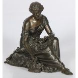 A bronze sculpture of a seated Pomona.