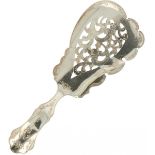 A fruit serving scoop.