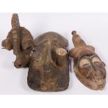 A lot comprising of (3) West African masks, 20th century.