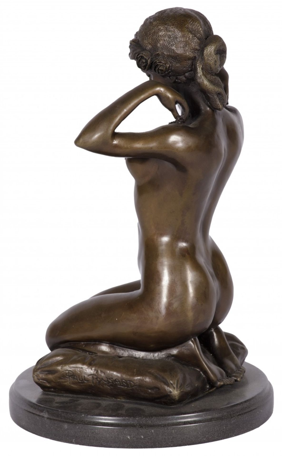 A bronze sculpture of a crouching gypsy on a pillow, France(?), 20th century.