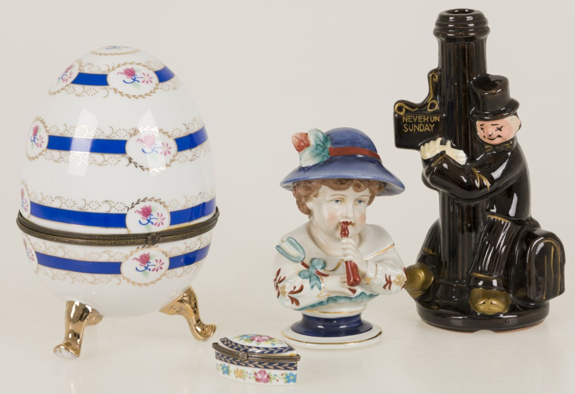 A lot of various items including a porcelain sculpture and a porcelain lidded box in the shape of an