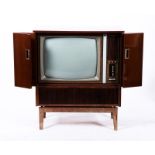 A Philips television in mahogany wood cabine, The Netherlands, 2nd half 20th century.