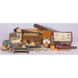 A lot comprised of various smoke ware, together with a razor and -sharpener, 20th century.