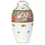 A porcelain lidded vase decorated with flowers. Tsjecho-Slovakia, 20th century.